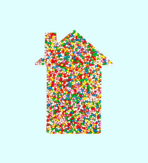 A house-shaped confectionery item covered in multicolored sprinkles. Perfect real estate agent gift