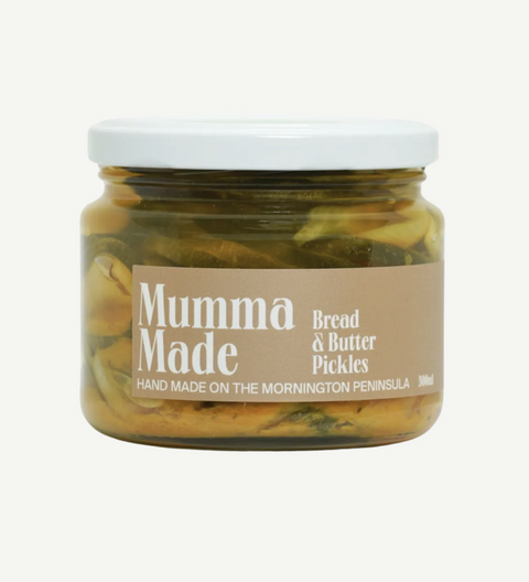 Jar of bread and butter pickles with 'Mumma Made' label on a white background