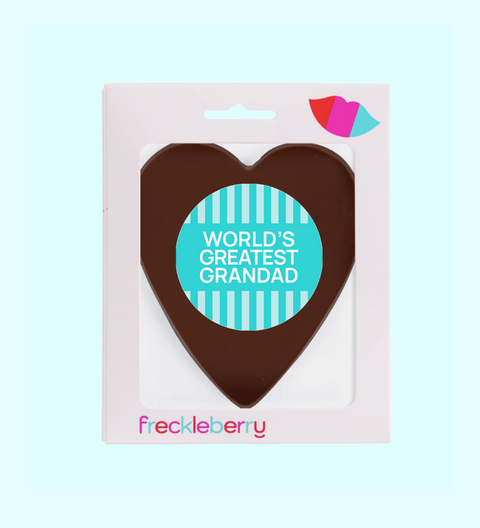 Heart-shaped chocolate with 'World's Greatest Grandad' text in a Freckleberry packaging on a light blue background