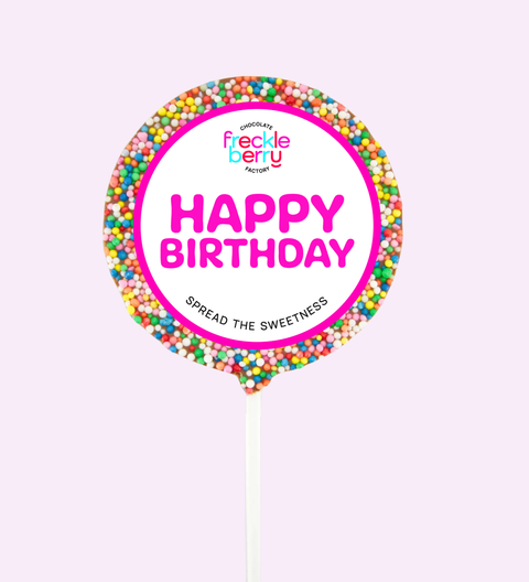 Freckle Berry birthday cake topper with colorful sprinkles and 'Happy Birthday' text on a light purple background.