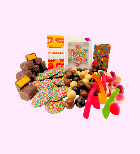 Luxury 'Congratulations' Chocolate Hamper
1 x Luxury White Gloss Hamper Gift Box
1 x Freckle Star with Box
1 x Premium Milk Chocolate 'Congrats' Block,
1 x 200g Milk Chocolate Freckles
1 x 200g Mixed Chocolate Raspberries
1 x 200g Lolly Jumble
1 x 200g Chocolate Honeycomb
1 x Fun Rocky Road
1 x Option to Add: 'Congrats To You' Message on Hamper