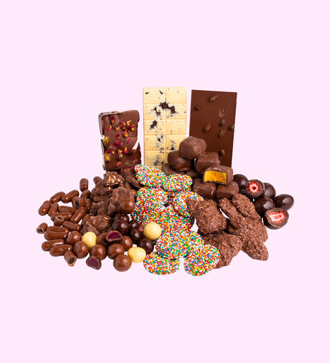 Luxury 'Ultimate Indulgence' Chocolate Hamper
1 x Luxury Gloss White Hamper Gift Box
1 x 200g Milk Chocolate Freckles
1 x 200g Mixed Chocolate Raspberries
1 x 200g Chocolate Honeycomb
1 x 150g Milk Chocolate Licorice Bullets
1 x 200g Coconut Rough
1 x 200g Peanut Clusters
1 x Turkish Delight Rocky Road
1 x Cookies and Cream White Chocolate Block
1 x Coffee Bean Milk Chocolate Block
1 x 150g Freeze Dried Dark Chocolate Strawberries
1 x Option to Add: Occasion Messages on Hamper