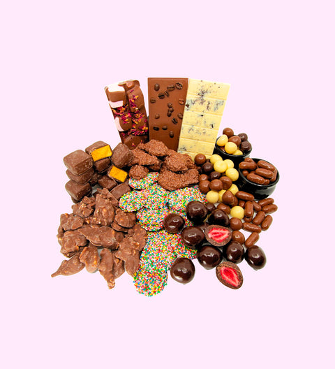 Luxury 'Ultimate Indulgence' Chocolate Hamper Contents:
1 x Luxury Gloss White Hamper Gift Box
1 x 200g Milk Chocolate Freckles
1 x 200g Mixed Chocolate Raspberries
1 x 200g Chocolate Honeycomb
1 x 150g Milk Chocolate Licorice Bullets
1 x 200g Coconut Rough
1 x 200g Peanut Clusters
1 x Turkish Delight Rocky Road
1 x Cookies and Cream White Chocolate Block
1 x Coffee Bean Milk Chocolate Block
1 x 150g Freeze Dried Dark Chocolate Strawberries
1 x Option to Add: Occasion Messages on Hamper