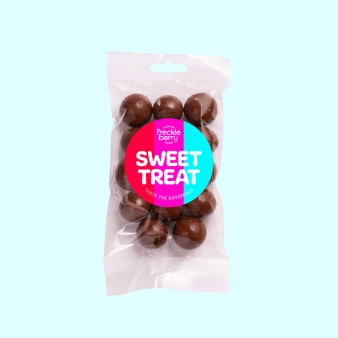 Close-up of milk chocolate coated macadamias