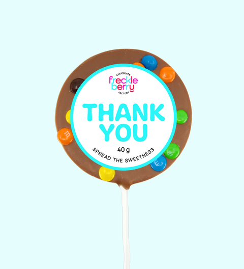 Chocolate lollipop with a 'Thank You' label on a light blue background