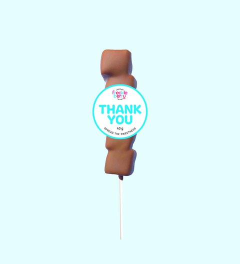 Chocolate-covered strawberry with a 'Thank You' label on a light blue background