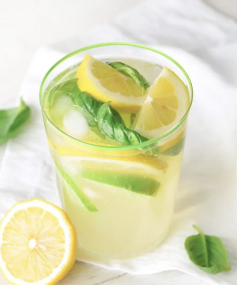 Refreshing lemon basil cordial poured over ice