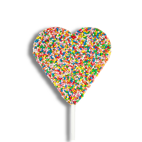 A heart-shaped chocolate lollipop covered with multicolored sprinkles on a white background.