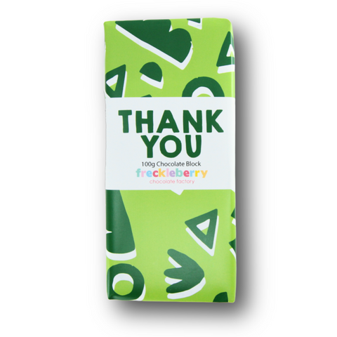 A wrapped chocolate block with 'THANK YOU' text on the packaging.