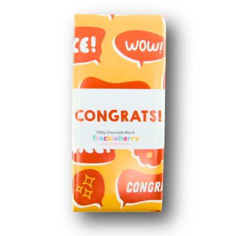 A wrapped chocolate block with 'CONGRATS' text and various congratulatory phrases printed in orange color.