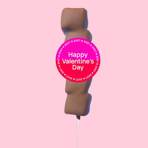 A chocolate covered marshmallow lollipop with a 'Happy Valentine's Day' label.