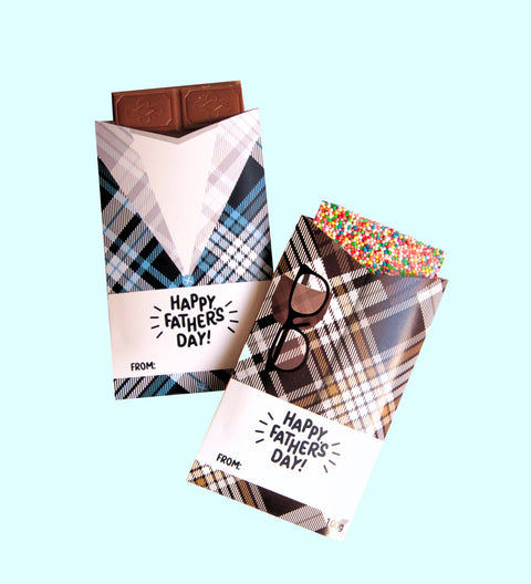 A chocolate block with a 'Happy Father's Day' message, wrapped in a gingham plaid sleeve with blue and white colors.