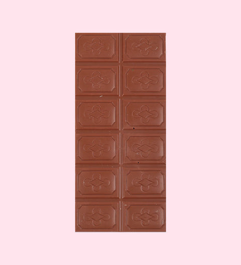 A premium Belgian chocolate block, with visible textured patterns on the surface, placed on a light-colored background.