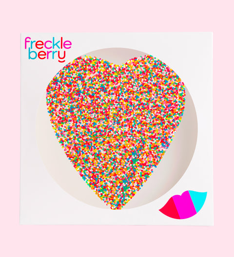 A large heart-shaped Belgian chocolate covered in multicolored sprinkles, with the text 'MY SWEET HEART' and the Freckleberry logo on top.