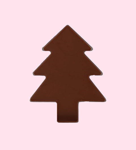 A plain dark chocolate tree-shaped treat against a pink background.