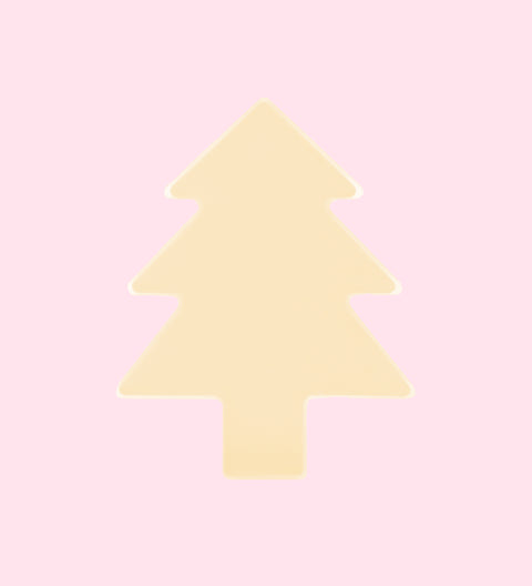 A plain white chocolate tree-shaped treat against a pink background.