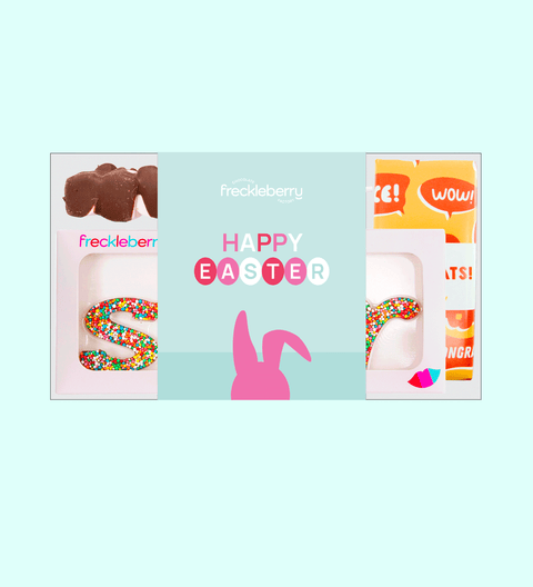An Easter-themed gift box from Freckleberry featuring a chocolate bunny, marshmallow pops, and other Easter treats with 'Happy Easter' text displayed.