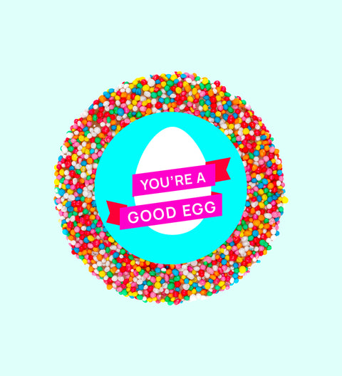 Individually wrapped colorful Easter freckle candy with a text overlay reading 'YOU'RE A GOOD EGG'.