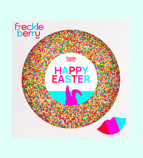 A colorful giant chocolate Easter freckle treat with 'HAPPY EASTER' text and sprinkles, from Freckleberry brand.
