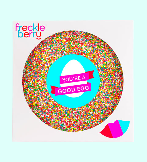 A colorful giant chocolate Easter freckle treat with 'HAPPY EASTER' text and sprinkles, from Freckleberry brand.