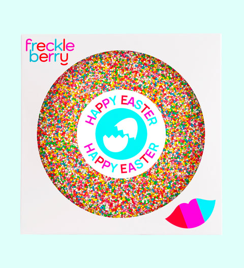 A colorful giant chocolate Easter freckle treat with 'HAPPY EASTER' text and sprinkles, from Freckleberry brand.