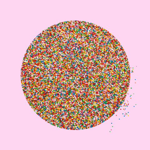A large giant chocolate freckle covered in multicolored sprinkles, with the 'freckleberry' logo in the corner.
