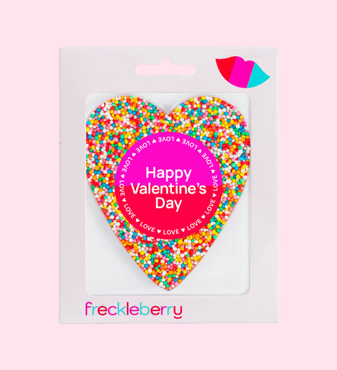 A heart-shaped chocolate covered in multicolored sprinkles with a 'Be My Valentine' message in the center.