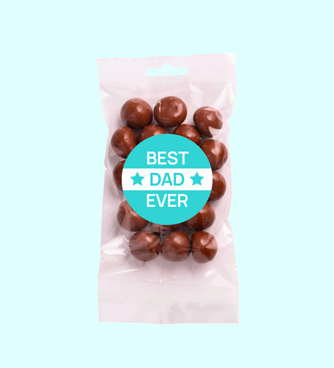 A clear plastic packaging containing milk chocolate coated raspberries with a 'Happy Father's Day' sticker on the front.