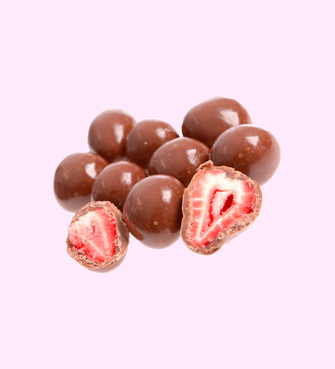 Close-up of milk choc strawberries with crunchy centre