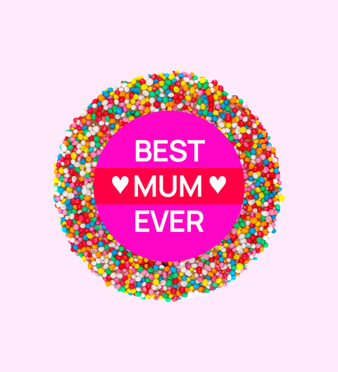 A colorful chocolate freckle with 'BEST MUM EVER' text in the center, presented on a pink background.