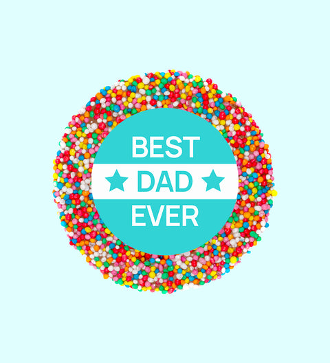 A chocolate freckle with 'BEST DAD EVER' written in the center, against a blue background.
