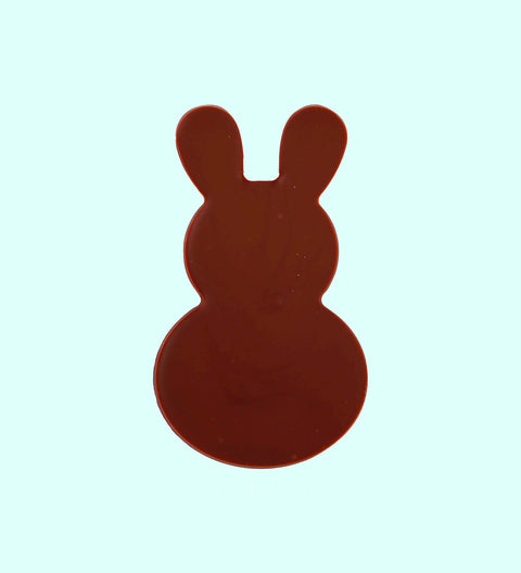Milk chocolate bunnies in different shades of brown, beige, and dark chocolate, arranged side by side against a white background.