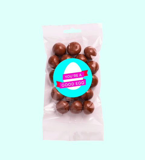 Sweet treat bags milk chocolate coated raspberries with a 'Happy Easter' label on the front.