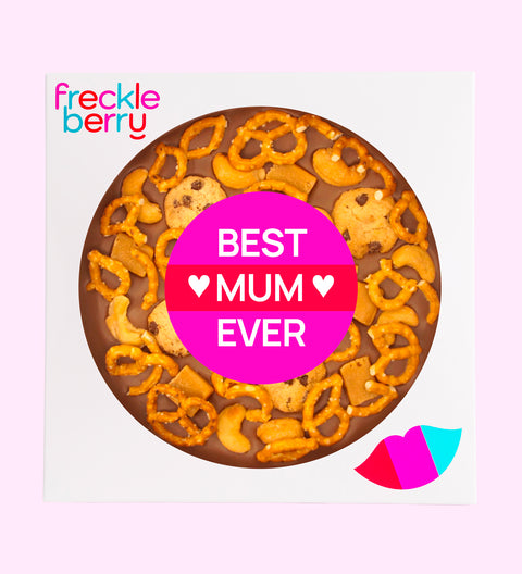 A promotional image featuring a large chocolate pizza with pretzels, chocolate chips, and nuts, topped with a 'Best Mum Ever' label.