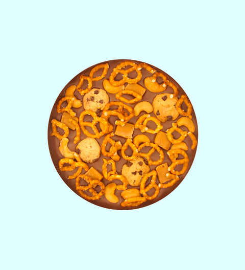 Large snack time pizza with pretzels, caramle, cashews and cookies. Delicious for a gift, event and something for chocolate lovers