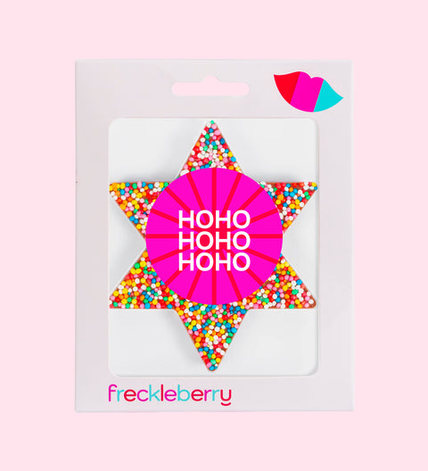A packaged chocolate star shaped with 'HOHOHO' text and colourful sprinkles design, branded 'freckleberry'.