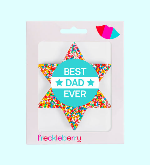 A chocolate freckle in the shape of a star with a 'Happy Father's Day' sticker, multicolored sprinkles, and the brand name 'freckleberry' at the bottom.