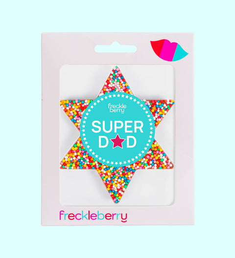 A chocolate freckle in the shape of a star with a 'Happy Father's Day' sticker, multicolored sprinkles, and the brand name 'freckleberry' at the bottom.