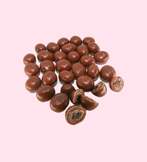 Close-up of milk chocolate coated sultanas
