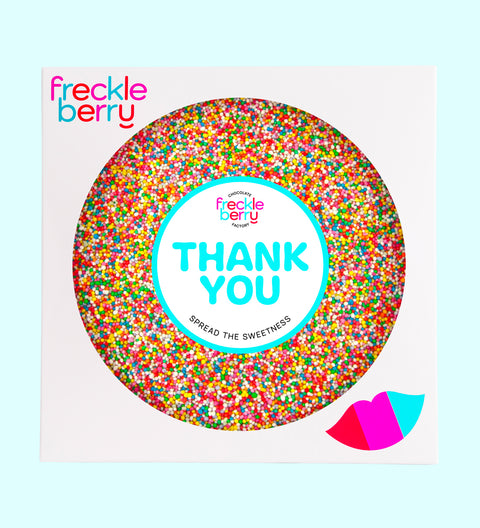 A large round Belgian chocolate covered in multicolored sprinkles with a 'THANK YOU' message in the center.