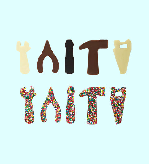A collection of chocolate tools including shapes of a hammer, pliers, and wrench, arranged to spell out 'DIY'.