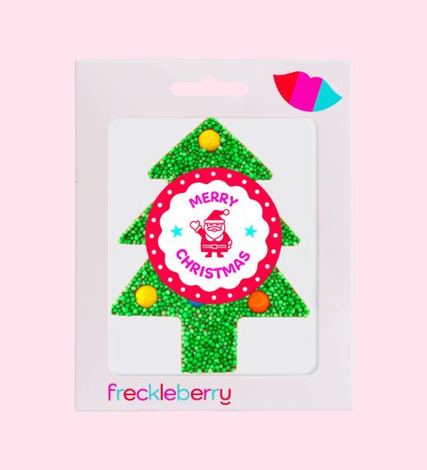 Packaged Christmas-themed green freckle M&M chocolate in the shape of a tree with a 'Merry Christmas' message, adorned with colorful sprinkles.