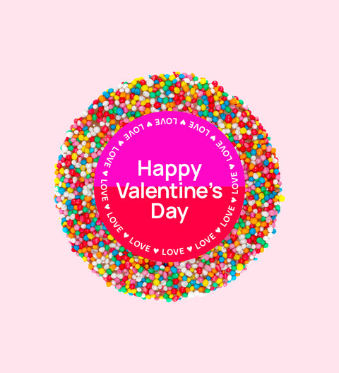A colorful chocolate freckle with 'Happy Valentine's Day' text in the center.