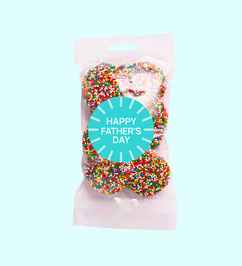 A clear plastic bag filled with milk chocolate freckles, sealed with a 'Happy Father's Day' sticker.