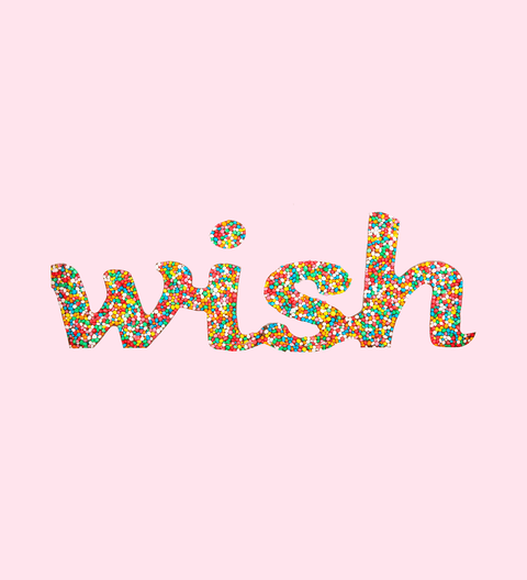 chocolate word 'wish' in a multicolored pattern against a pink background.