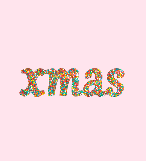 The word 'xmas' written in colorful sprinkles chocolate