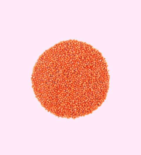 Creamy Belgian chocolate (in 3 variants - milk, dark or white) covered with orange freckles/sprinkles.