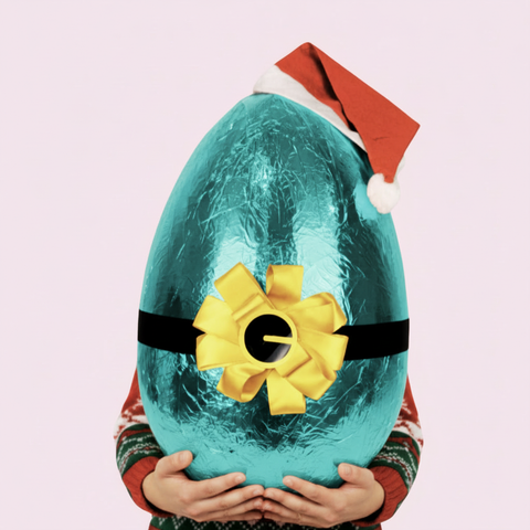 A luxurious Belgian milk chocolate santa egg wrapped in vibrant aqua foil packaging, perfect for an indulgent and show-stopping Christmas gift.