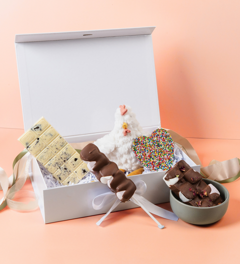An indulgent selection of premium Belgian chocolates and white chicken plus toy, customised for festive gifting to celebrate the coming of a new member of the family.