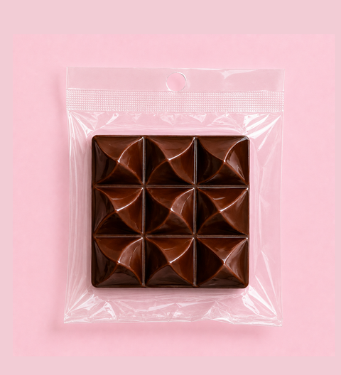 Square block of milkchocolate with a geometric pattern premium belgian chocolate